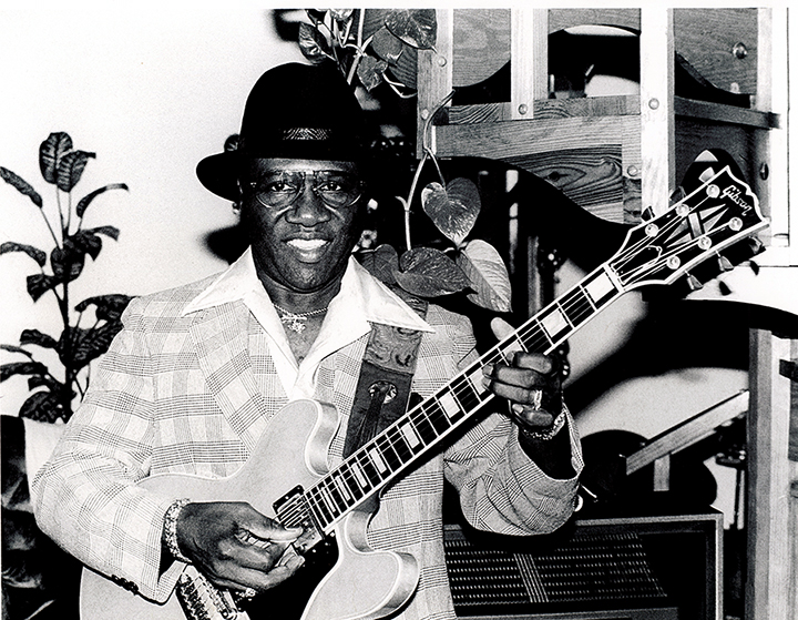 HEnry Hubbard with his guitar, photo by Clay Shorkey